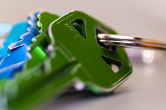 Green and blue tinted keys on a key ring