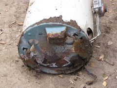A rusted and corroded tank water heater